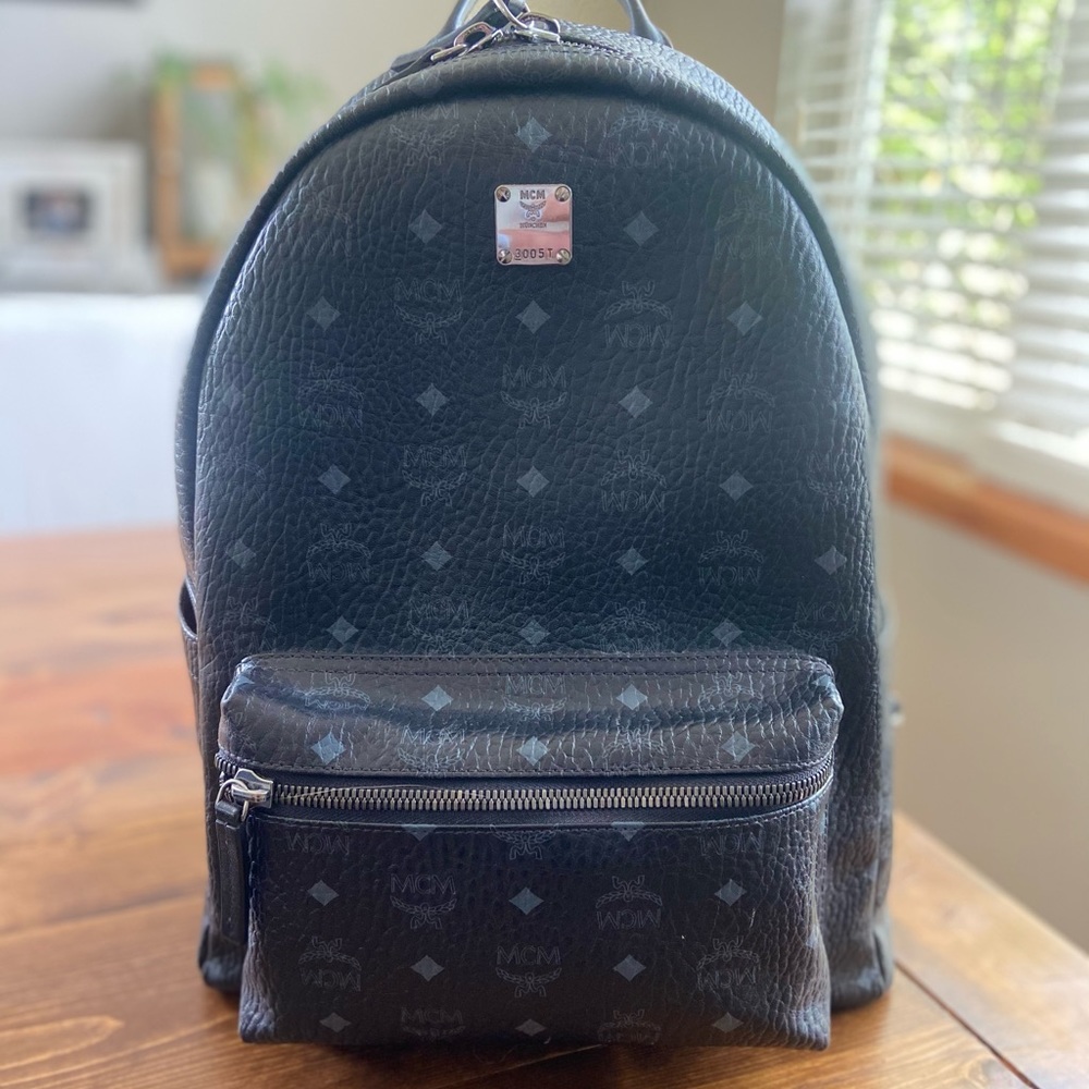 MCM - Men’s black monogram backpack. Excellent condition!!